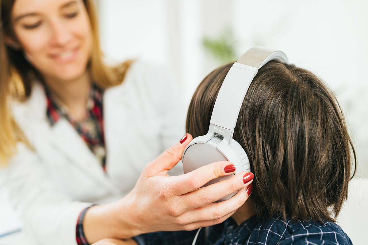 Woman Fitting Headphones For Hearing Test